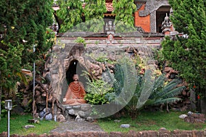 The cave and garden in Brahmavihara Arama monastery, Bali Island (Indonesia) photo