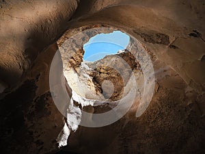 Cave with a hole looking into the sky