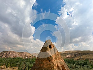 Cave house at the top of a sandstone spire