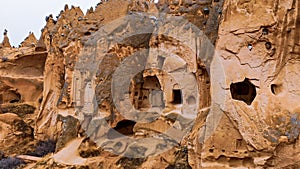 Cave houses and monasteries carved into tufa rocks at Zelve Valley in Cappadocia, Turkey