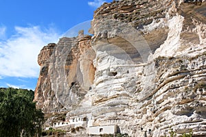 Cave houses near Alcala del Jucar, Spain photo