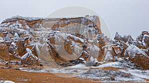 Cave houses surrounded by rock formations in Cappadocia, Turkey