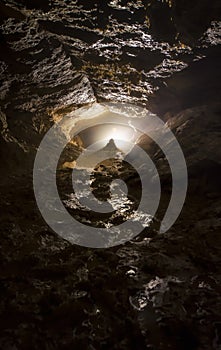 Cave with light and stalagmite