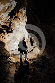 Cave with man silhouette explorer