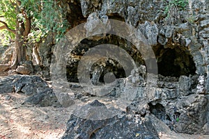 cave model in karst mountain with stalactite rocks.