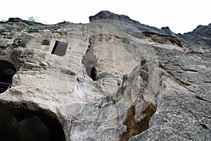 Cave monastery coverd in rock, Vardzia