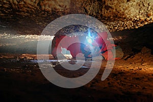 Cave passage with a spelunker photo