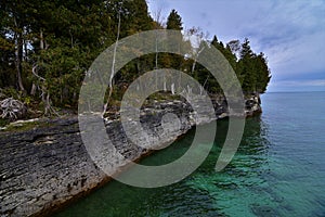 Cave point county park door county wisconsin rock shoreline along lake Michigan with trees turning Fall color