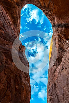 Cave Point Escalante Looking up at the sky from the inside