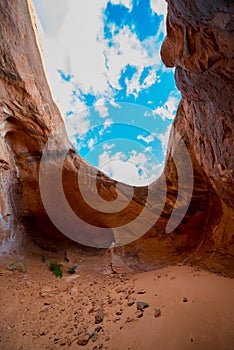 Cave Point Escalante Looking up at the sky from the inside