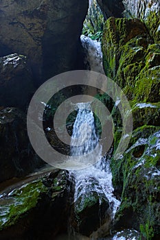Cave river and waterfall