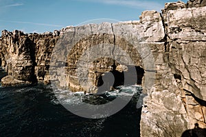 Cave in a rock ashore ocean, Portugal