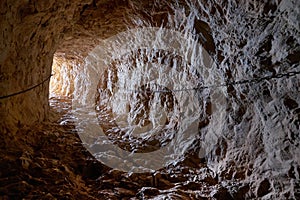 Cave rock tunnel through rock formation photo