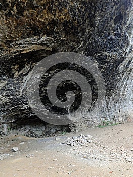 cave in the rock used by primitive men as a shelter in prehistor