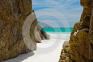 Cave in the rocks in a Crystalline clear sea photo