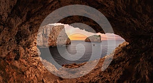 Cave on Rocky Coast with Cliffs on the Mediterranean Sea. Sardinia, Italy. Background.