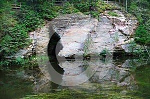 Cave in sandstone outcrops of Ahja river photo