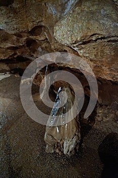 Cave stalagmite formations wet stones