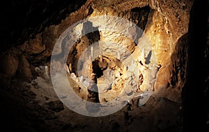 Cave stalagmite in undergorund photo