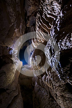 Cave underground with limestone formations
