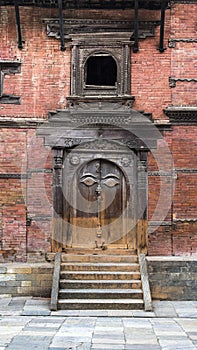 Caved balcony and gate of Hanuman Dhoka , the Royal palace , Durbar Square , Kathmandu , Nepal , 2014 photo