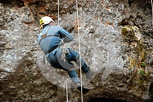 Caver abseiling in a pothole.