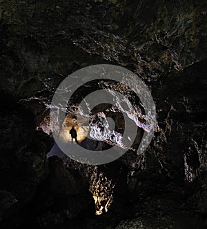 Caver in a cave photo