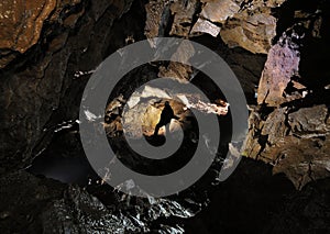 Caver in a cave photo