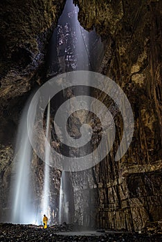 Caver at the end of the Line in Gaping Gill photo