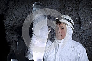 Caver explores ice stalagmite