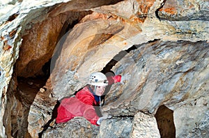 Caver exploring the cave photo
