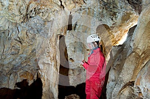 Caver logging survey data during cave mapping photo