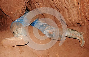 Caver in a narrow passage photo