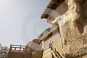 Caves cut into cliff face at Mogao Grottoes, Dunhuang, Ganzu, Ch
