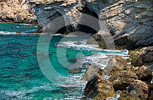 The caves of the elevated rocky shore of Cape Greco. Cyprus