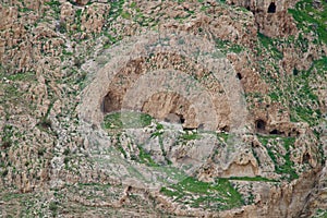 Caves in a grassed mountain