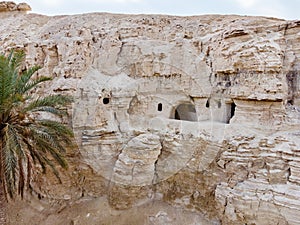 The caves  of the hermits are located near the Deir Hijleh Monastery - Monastery of Gerasim of Jordan in the Judean Desert in