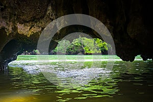 Caves in limestone cliffs, Phang Nga Bay, Thailand