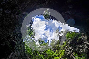 Caves in limestone cliffs, Phang Nga Bay, Thailand photo