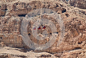 Caves of the Mount of Temptation in the desert with cable cars