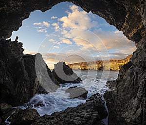 Caves at the ocean cliff in Monumento Natural de las Cuevas de Ajuy photo