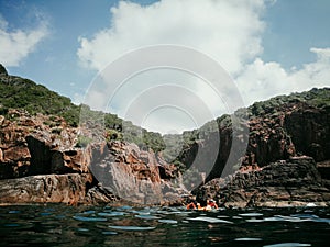 The caves of the Pulau Pinang on the island of Redang on a bright sunny summer day.