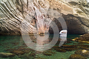 Caves and rock formations by the sea at Sarakiniko area on Milos island,a Greece