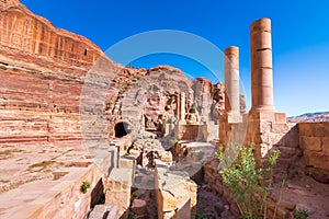 Caves in sandstones, columns and ruins of the ancient Bedouin city of Petra, Jordan