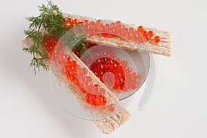 Caviar of a salmon and small loafs with caviar