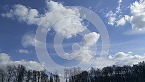 The cavitation flow of air between the Cumulus clouds above the spruce forest