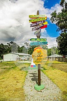 CAYAMBE, ECUADOR - SEPTEMBER 05, 2017: Informative sign of distance from Cayambe, of different countries written over a