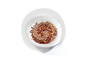 Cayenne pepper and chilli pepper in bowl on white background