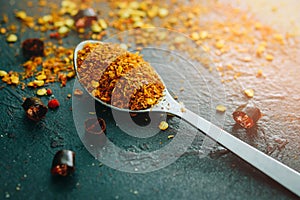 Cayenne pepper on the vintage wooden background , Spicy Seasoning Powder, selective focus