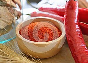 Cayenne pepper in wooden bowl
